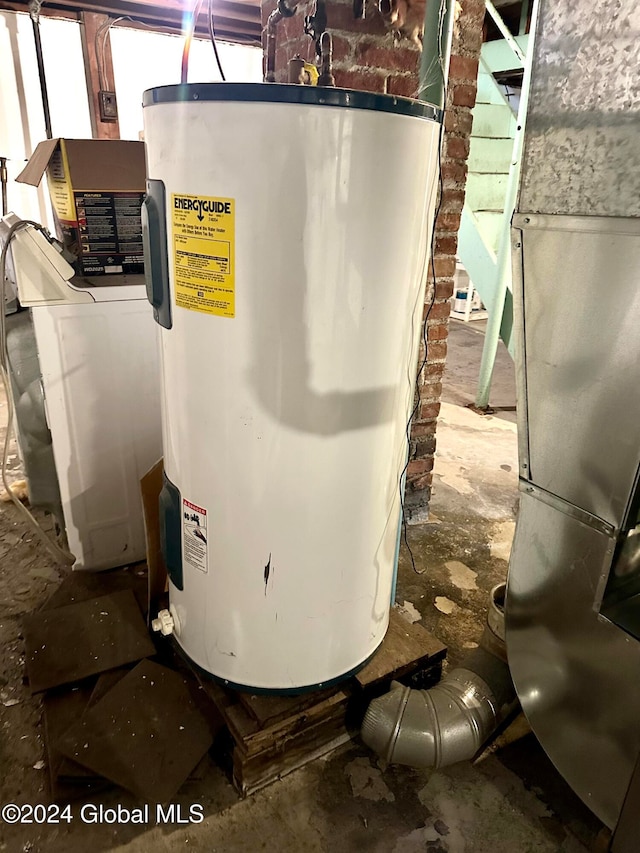 utility room featuring water heater