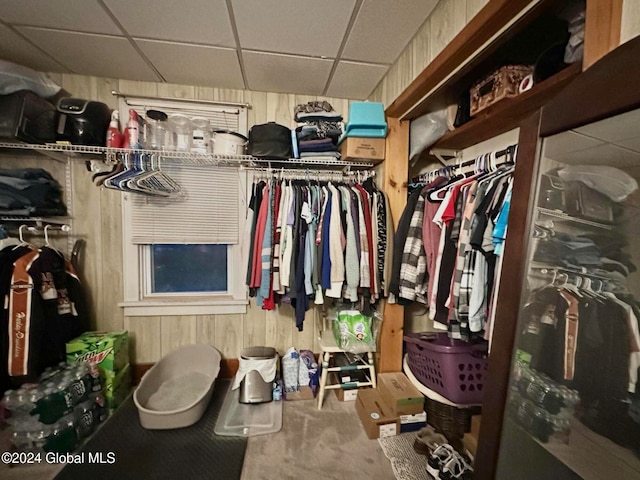 spacious closet with a paneled ceiling