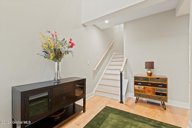 stairway featuring wood-type flooring