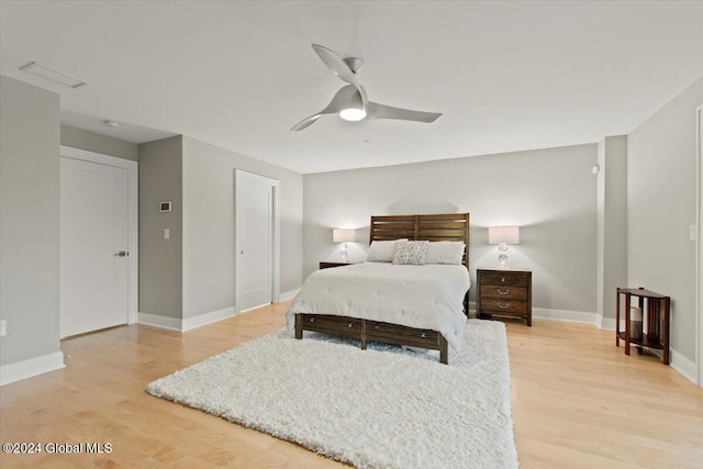 bedroom featuring light wood-type flooring and ceiling fan