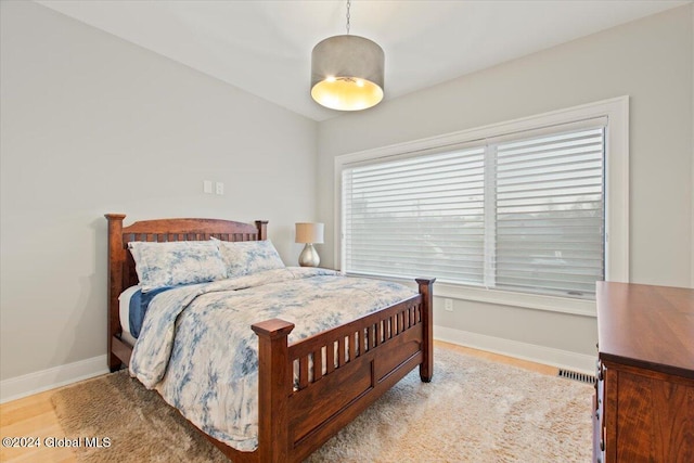 bedroom with light wood-type flooring