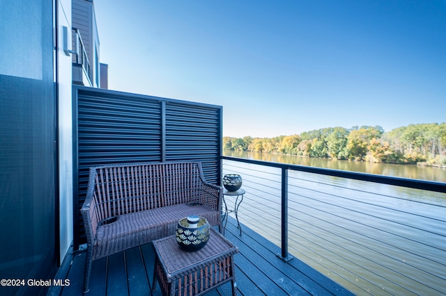 balcony featuring a water view