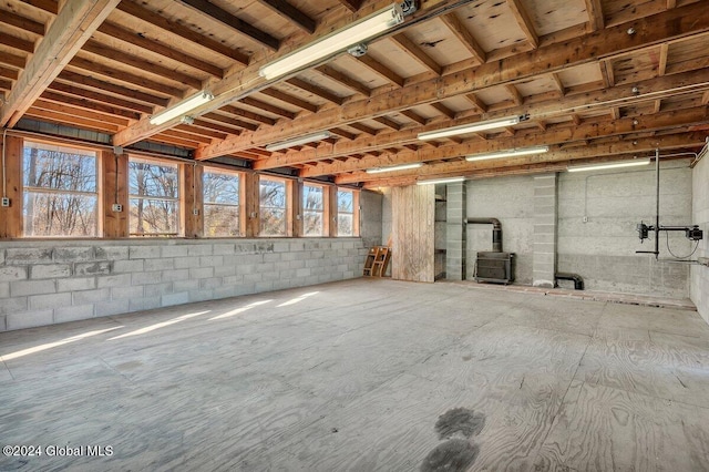 basement featuring a wood stove