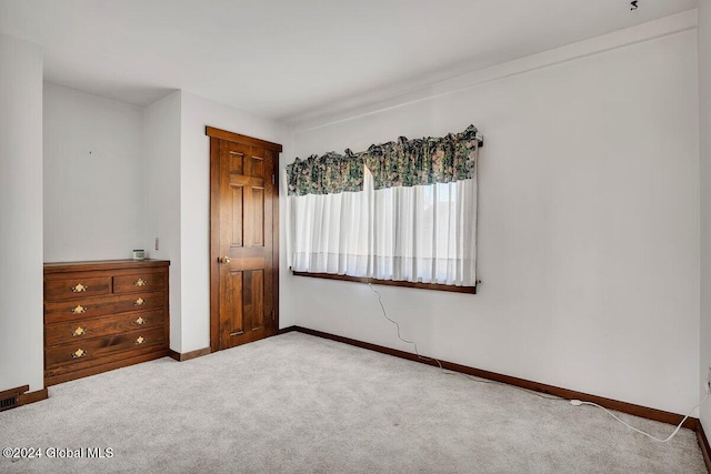 unfurnished bedroom with carpet flooring