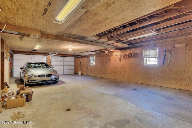 garage featuring wooden walls