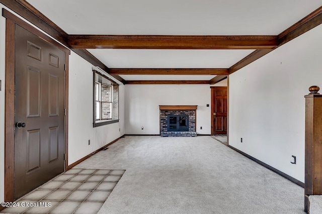 unfurnished living room featuring light carpet, beam ceiling, and a brick fireplace