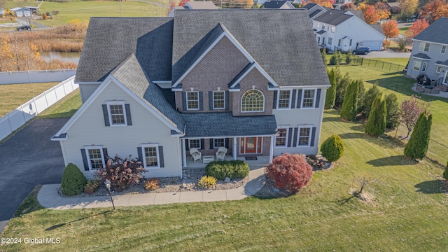 5 Teasdale Ct, Colonie, NY 12189 - view of front facade featuring fence, roof with shingles, and a front yard