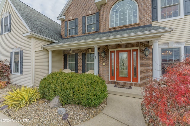 doorway to property with covered porch