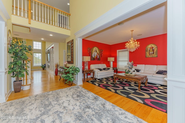 5 Teasdale Ct, Colonie, NY 12189 - living area featuring wood finished floors and a notable chandelier