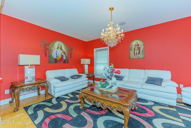 5 Teasdale Ct, Colonie, NY 12189 - living room with baseboards, wood finished floors, and a chandelier