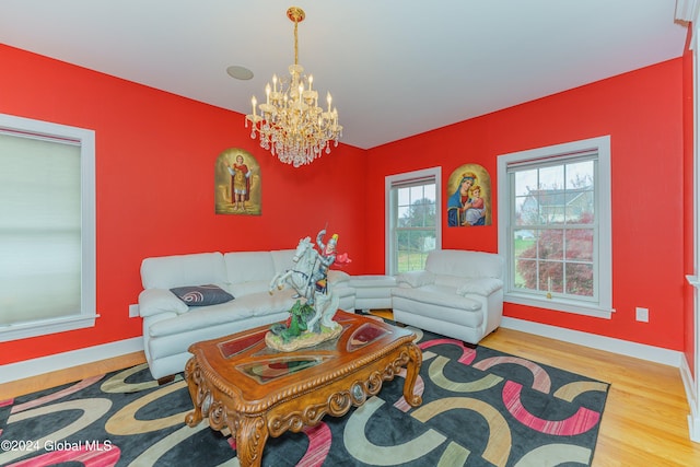 5 Teasdale Ct, Colonie, NY 12189 - living area featuring baseboards, wood finished floors, and a notable chandelier
