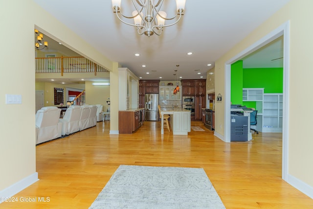 5 Teasdale Ct, Colonie, NY 12189 - living area featuring light wood-type flooring, recessed lighting, baseboards, and a notable chandelier