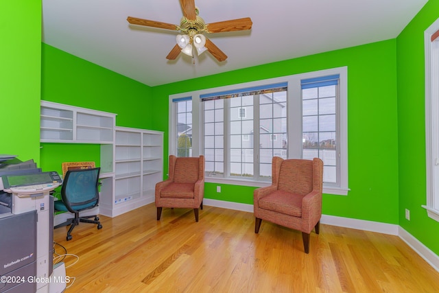 office area with light hardwood / wood-style flooring, a wealth of natural light, and ceiling fan