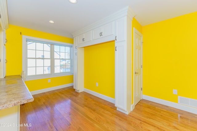 spare room featuring light wood-type flooring