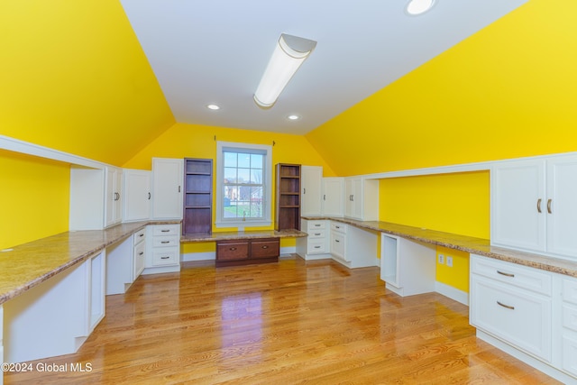 5 Teasdale Ct, Colonie, NY 12189 - kitchen featuring white cabinetry, vaulted ceiling, and built in study area