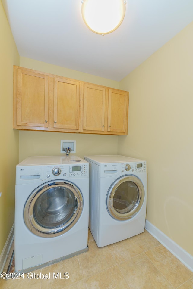 5 Teasdale Ct, Colonie, NY 12189 - clothes washing area with baseboards, cabinet space, and washing machine and clothes dryer