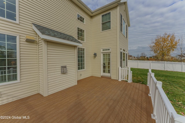 wooden deck with a lawn