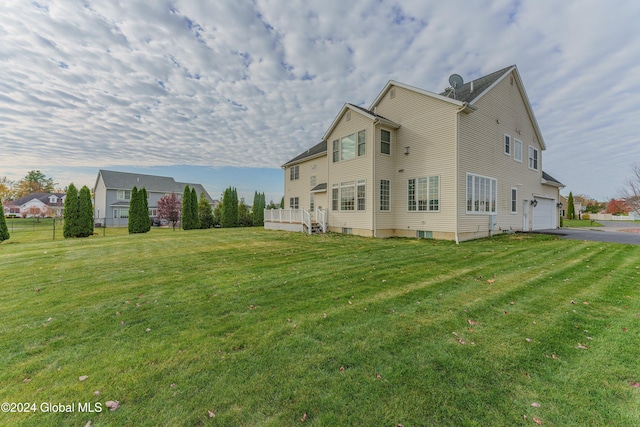 5 Teasdale Ct, Colonie, NY 12189 - view of side of property featuring a lawn, aphalt driveway, and a deck