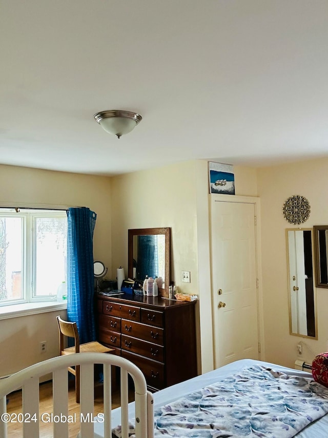 bedroom with wood-type flooring