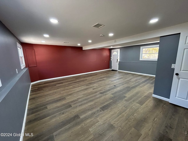 spare room featuring dark wood-type flooring