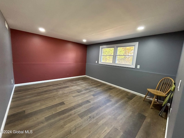 empty room with dark hardwood / wood-style floors