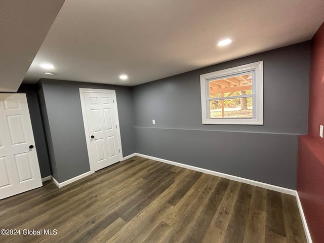 basement featuring dark wood-type flooring