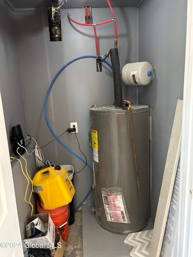 utility room featuring gas water heater