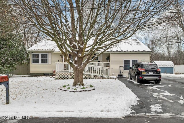 15 Windcrest Dr, Fort Edward, NY 12828 - view of front of home featuring covered porch and asphalt driveway