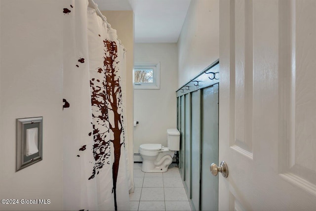 bathroom featuring tile patterned floors, a baseboard radiator, and toilet