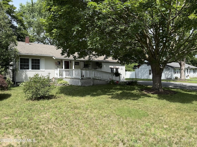 15 Windcrest Dr, Fort Edward, NY 12828 - single story home with a chimney, a front lawn, and a wooden deck