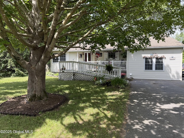 15 Windcrest Dr, Fort Edward, NY 12828 - view of property hidden behind natural elements featuring a porch, driveway, and a front yard