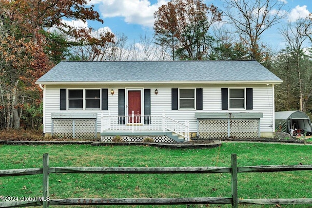 ranch-style home featuring a front yard