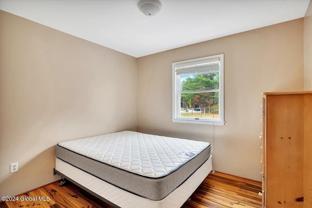 bedroom featuring wood-type flooring