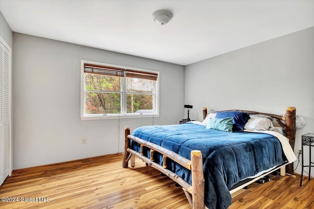 bedroom with hardwood / wood-style flooring