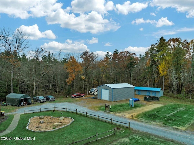 exterior space featuring a storage shed and a lawn