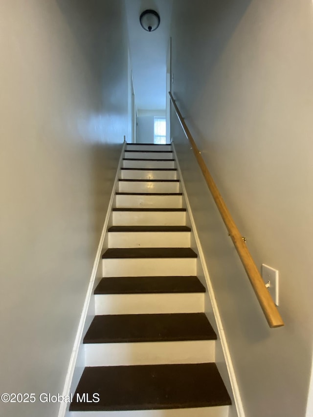 stairs featuring baseboards