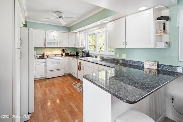 kitchen featuring kitchen peninsula, white cabinetry, light hardwood / wood-style flooring, ornamental molding, and white appliances