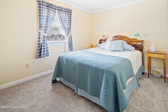 carpeted bedroom featuring ornamental molding