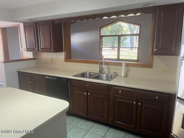 kitchen with sink, dark brown cabinets, dishwasher, and light tile patterned floors