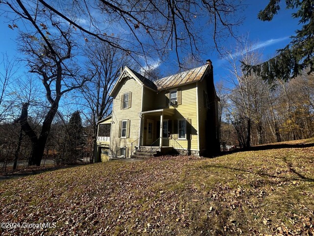 109 High St, Cobleskill, NY 12043 - traditional-style house with metal roof, a standing seam roof, and central AC unit