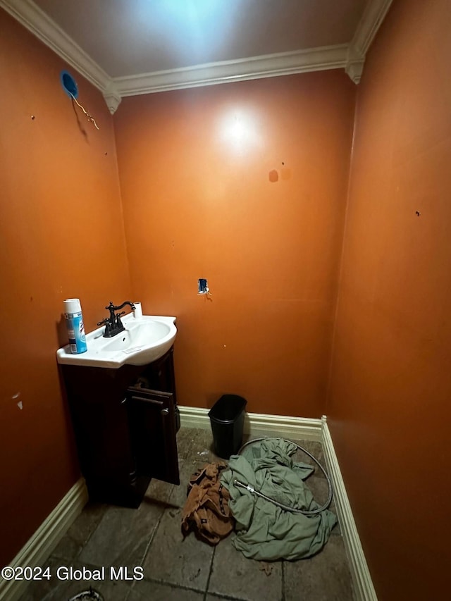 109 High St, Cobleskill, NY 12043 - bathroom featuring crown molding, vanity, and baseboards