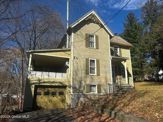 109 High St, Cobleskill, NY 12043 - view of property exterior featuring an attached garage and a balcony