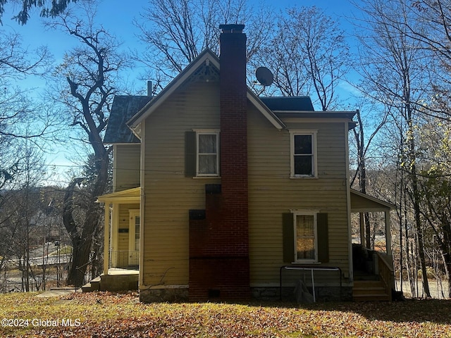 109 High St, Cobleskill, NY 12043 - back of property with a chimney