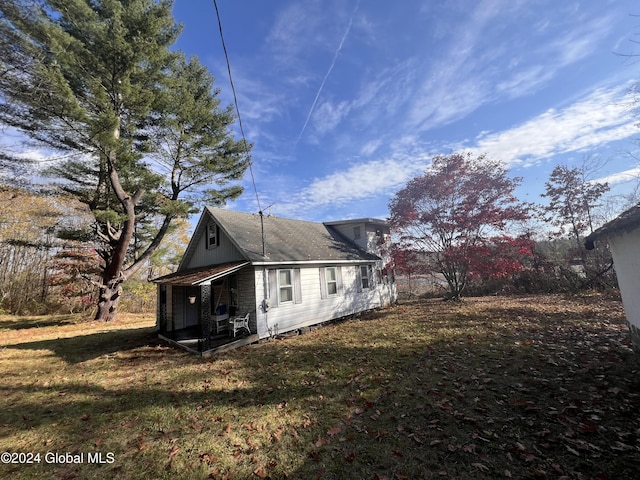 123 Iroquois Trail Rd, Amsterdam, NY 12177 - view of home's exterior with a lawn