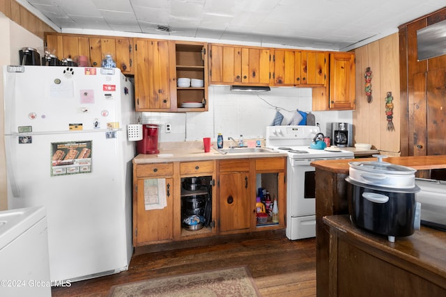 kitchen featuring decorative backsplash, dark hardwood / wood-style flooring, white appliances, and sink