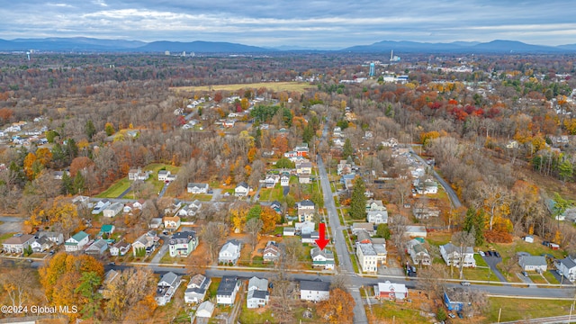 birds eye view of property featuring a mountain view