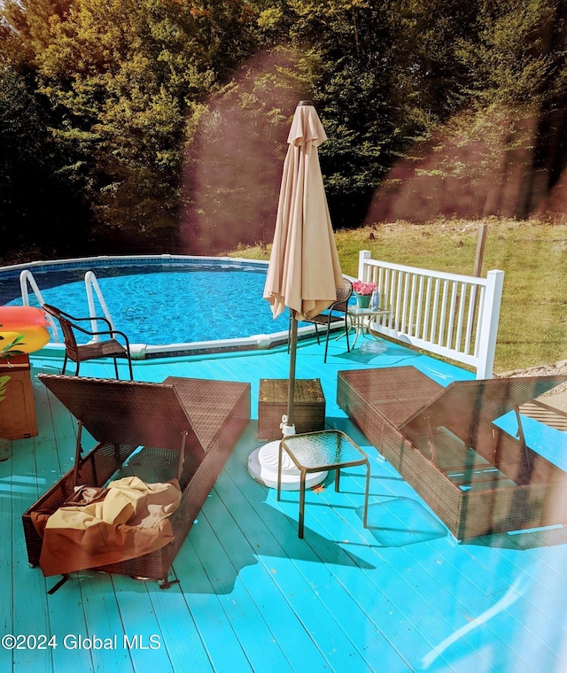 view of pool featuring a wooden deck