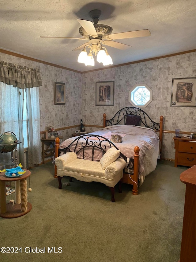 carpeted bedroom featuring ceiling fan, multiple windows, a textured ceiling, and ornamental molding