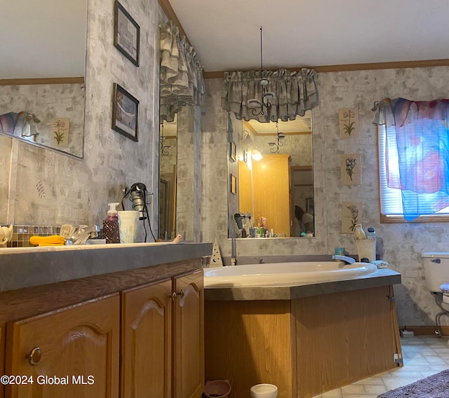 bathroom with vanity and ornamental molding