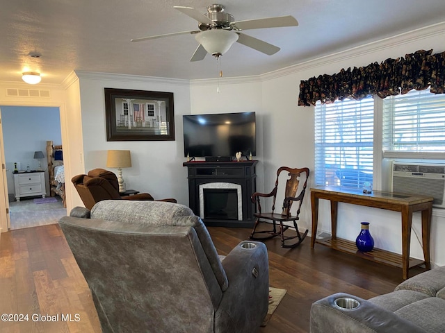 living room with dark wood-type flooring, cooling unit, a high end fireplace, crown molding, and ceiling fan